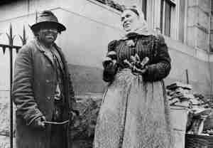 Two hawkers selling their goods.